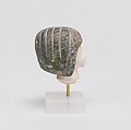 Head from a Spoon in the form of a Swimming Girl, Travertine (Egyptian alabaster), steatite