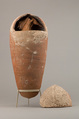 Sacred animal mummy of an ibis inside a jar, Pottery, linen, animal remains, mummification materials