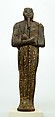 Shabti of Amenhotep III, Ebony; eyes inlaid with blue, white, black glass;  inscription filled with pigment