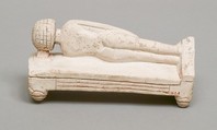 Reclining female figure on a bed, Limestone, paint