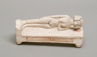 Reclining female figure on a bed, Limestone, paint