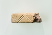 A fragment of a cubic unknown object, possibly a fragment of a rod, White faience