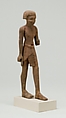 Statuette, striding man, Wood
