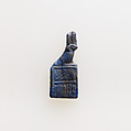 Amulet of serekh sign surmounted by archaic falcon, Glass