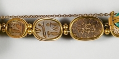 Nine scarabs set in modern bracelet., Glazed steatite, gold