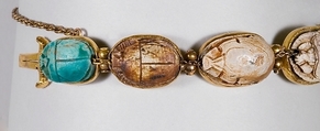 Nine scarabs set in modern bracelet., Glazed steatite, gold