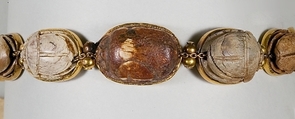 Nine scarabs set in modern bracelet., Glazed steatite, gold