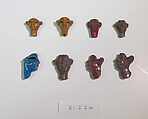 Inlays from shrine: heads, Glass