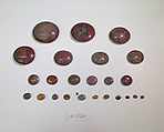 Inlays from shrine: rounded discs, one with cell for a wedjat, Glass