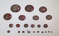 Inlays from shrine: rounded discs, one with cell for a wedjat, Glass