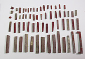 Inlays from shrine: box of red bars, Glass