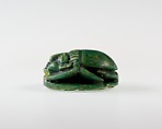 Human-face Scarab with Sphinx and Hieroglyphs, Dark green glazed steatite