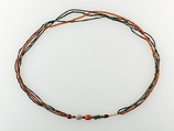 A Necklace of four strands of beads and amulets, Turquoise, amethyst, carnelian, Egyptian blue, faience, silver, plant resin