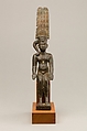 Child god with the Amonian crown named Horus of Mednit (Aphroditopolis), Cupreous metal, precious metal inlay