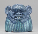 Part of a Mirror Handle depicting Bes, Faience