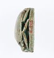 Scarab Inscribed With the Prenomen of Ramesses II and depicting the king in his chariot trampling an enemy, Steatite, blue glaze