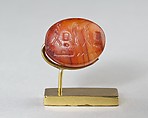 Scaraboid Bead with a device referring to Ptah, Carnelian or red jasper