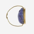 Scarab Finger Ring, Lapis lazuli scarab set in gold plate and on a gold wire ring
Lapis-lazuli