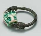 Ring with a Feline's Head, Steatite (glazed), copper<br/>Green glazed steatite lion head seal, mounted on copper wire ring