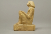 Statue of an asymmetrically seated man, Yellow limonite (G.L.Finlay)