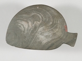 Fish-shaped palette with the remains of green pigment, Greywacke
