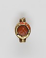 Scarab set in a ring bezel, carnelian, gold