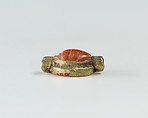 Scarab set in a ring bezel, carnelian, gold