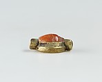 Scarab set in a ring bezel, carnelian, gold