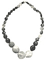 String of beads, Carnelian, garnet, green feldspar, amethyst, green jasper, black and white mottled stone