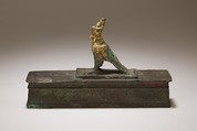 Falcon in double crown surmounting a shrine shaped box for an animal mummy, Cupreous metal, precious metal