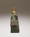 Falcon in double crown surmounting a shrine shaped box for an animal mummy, Cupreous metal, precious metal