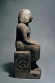 Seated woman, Sandy fossiliferous limestone