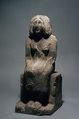 Seated woman, Sandy fossiliferous limestone