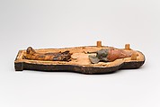 Coffin and corn mummy with Osiris mask, coffin: wood, paint 
mummy: grain, sand, clay and/or soil, resin, linen bandages 
mask: wax