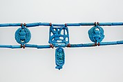 Necklace restrung with amulets and a faience cartouche bead of Tutankhamun, Faience