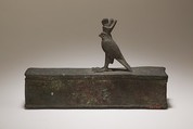 Case for an animal mummy topped by a falcon, Cupreous metal
