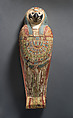 Falcon-form case containing a corn mummy, Painted gessoed wood; mummy: linen, resin, fiber