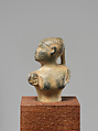 Statuette of a female figure with a braid, Steatite