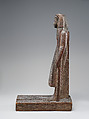 Statuette of Kary carrying a standard of Horus, Wood