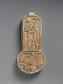 Counterweight of a <em>menit</em> necklace with an image of Bastet nursing King Taharqo, Faience