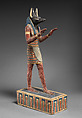 Statuette of a canid-headed god, probably Anubis, Plastered and painted wood