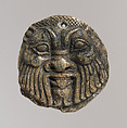 Bes head disk with scene of Isis and Horus in marsh on reverse, Steatite