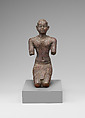 Statue of a kneeling Kushite king, Bronze; gold leaf
