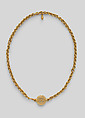 Necklace with ornate clasp ornament and a small drop pendant, gold