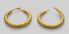 Spirally twisted tubular armlet with one goose-head terminal preserved, Gold
