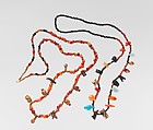 Necklace of ball beads and gold amulets, Gold over pitch, carnelian, lapis lazuli
Carnelian
Lapis-lazuli