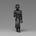 Priest in a leopard skin cloak with an inscription and Osiris on his skirt, Leaded bronze