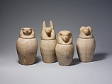 Canopic jar with a falcon-headed lid (Qebehsenuef), Travertine (Egyptian alabaster)