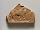 Relief plaque with ram, and on opposite side two feet, Limestone