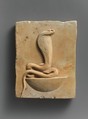 Relief plaque of cobra on a neb basket, Limestone